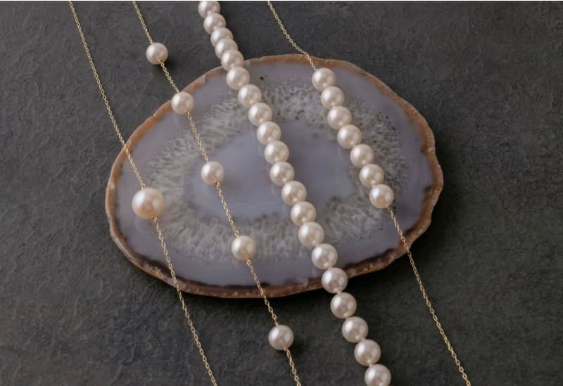 pearl strand on agate slice
